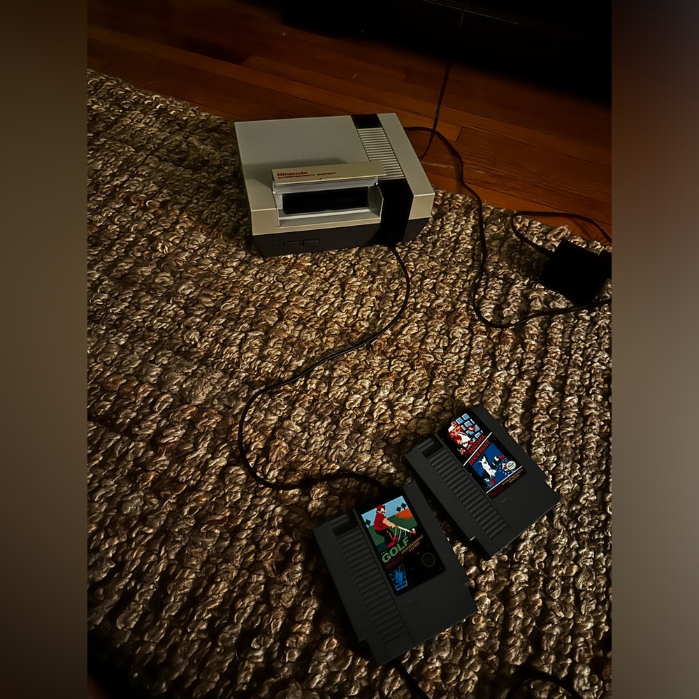 Original NES + 2 games and remote and all cables to watch and play